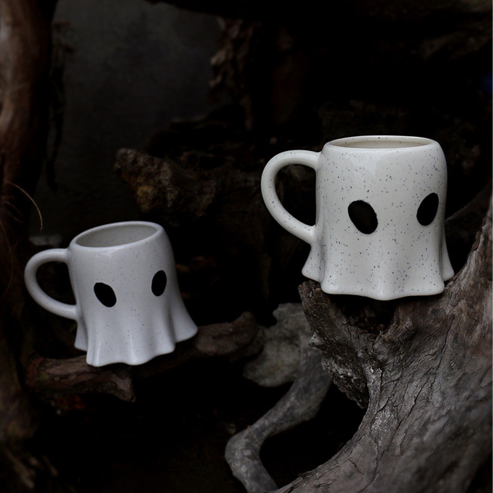 2 cups in a ghost shape with tiny eyes